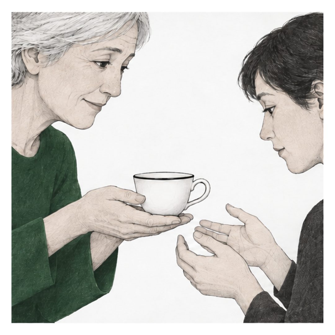 An older woman in green offers a small white teacup to a younger woman in charcoal. Their open hands meet around the cup against a white background.